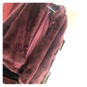 Maroon colored fur coat